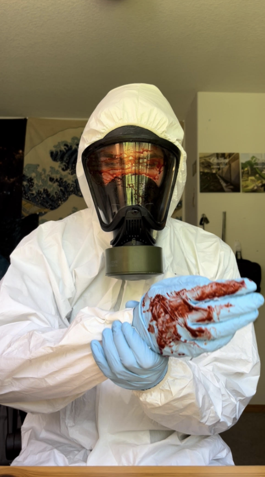 Jacob Suarez in white hazmat suit 